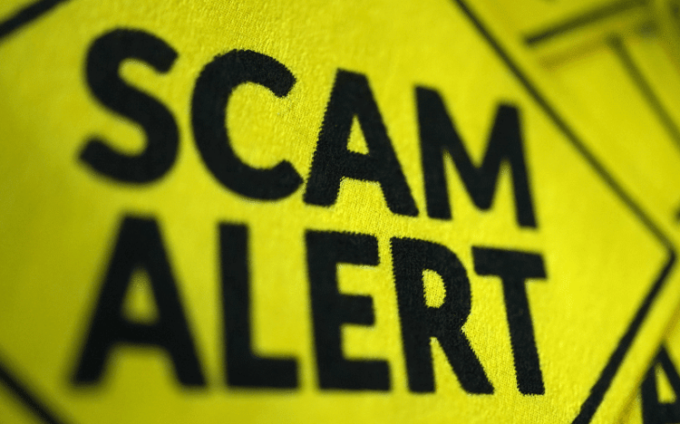 Sign that says Scam Alert