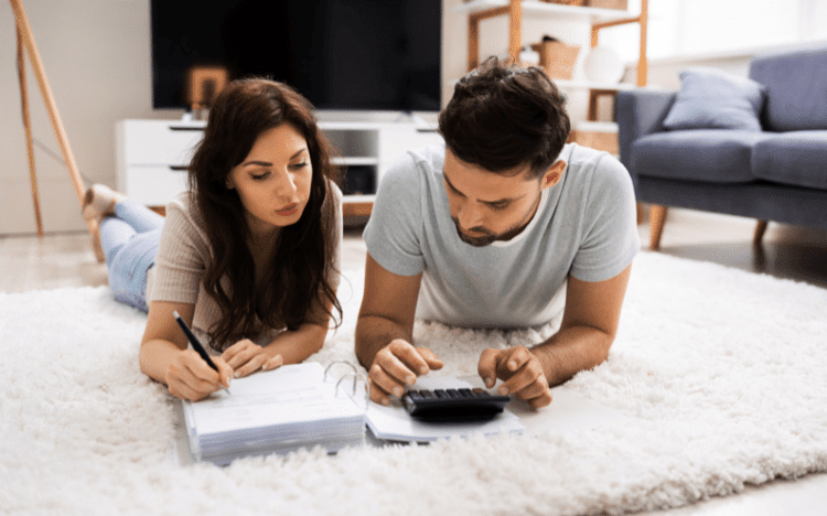 Two small business owners calculating how much money to put aside for taxes