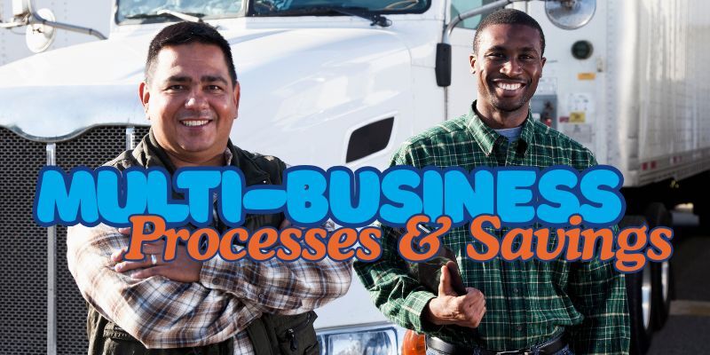 two happy men standing in front of truck